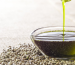 hemp oil benefits uses, drizzle hemp oil into a bowl and place on hemp seeds